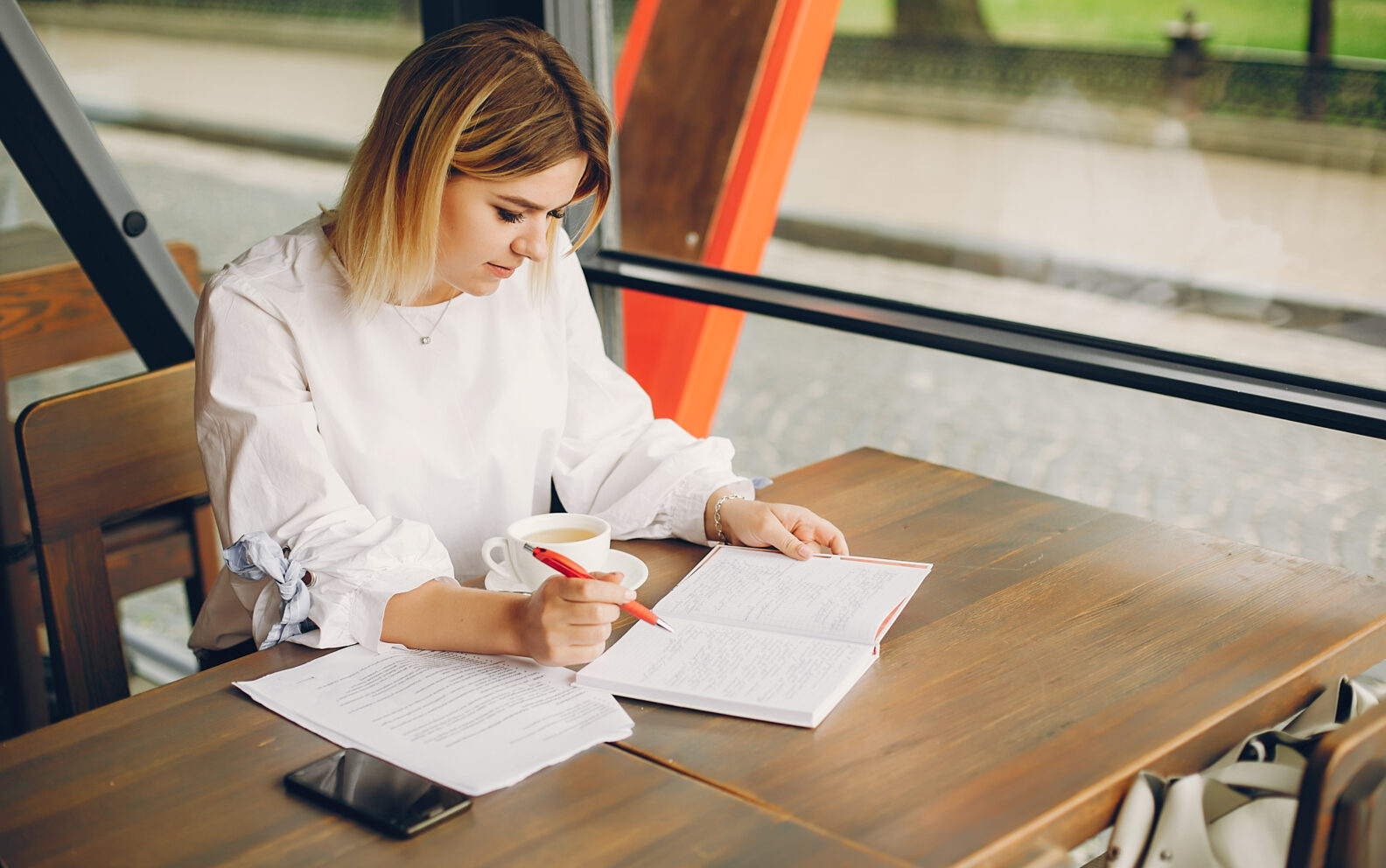 A confident student reading a passage or test paper